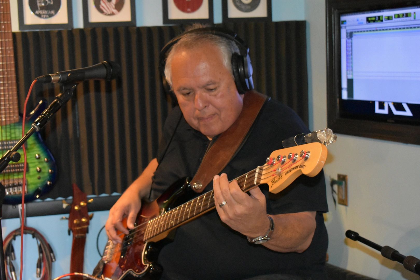 Recording studio session with bass guitar